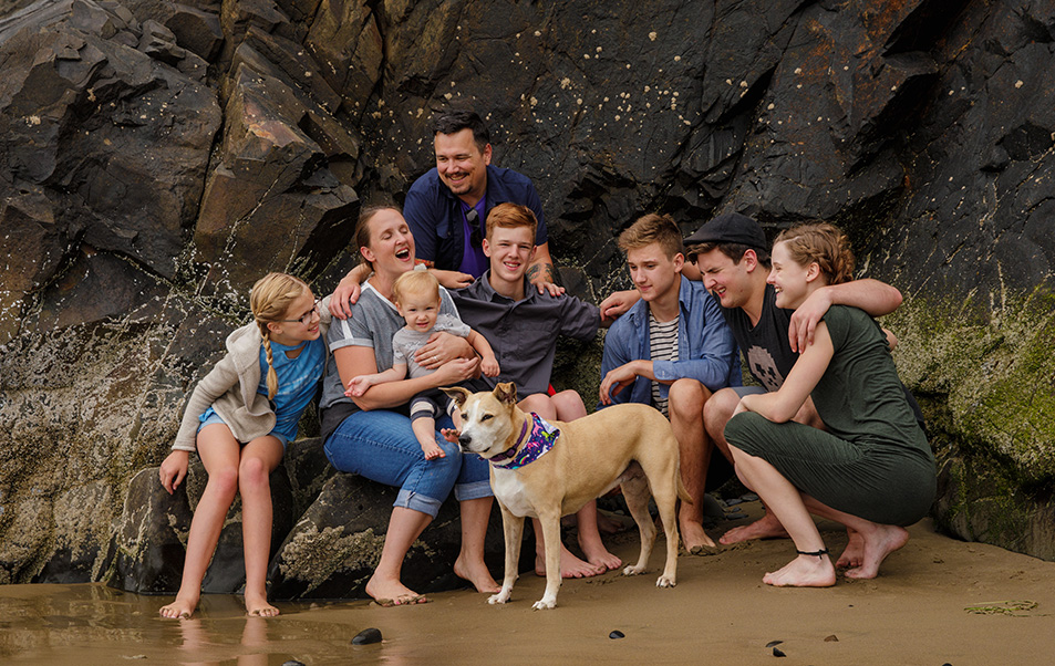 group of people sitting on rock