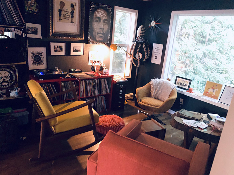 a room with several chairs and vinyl records